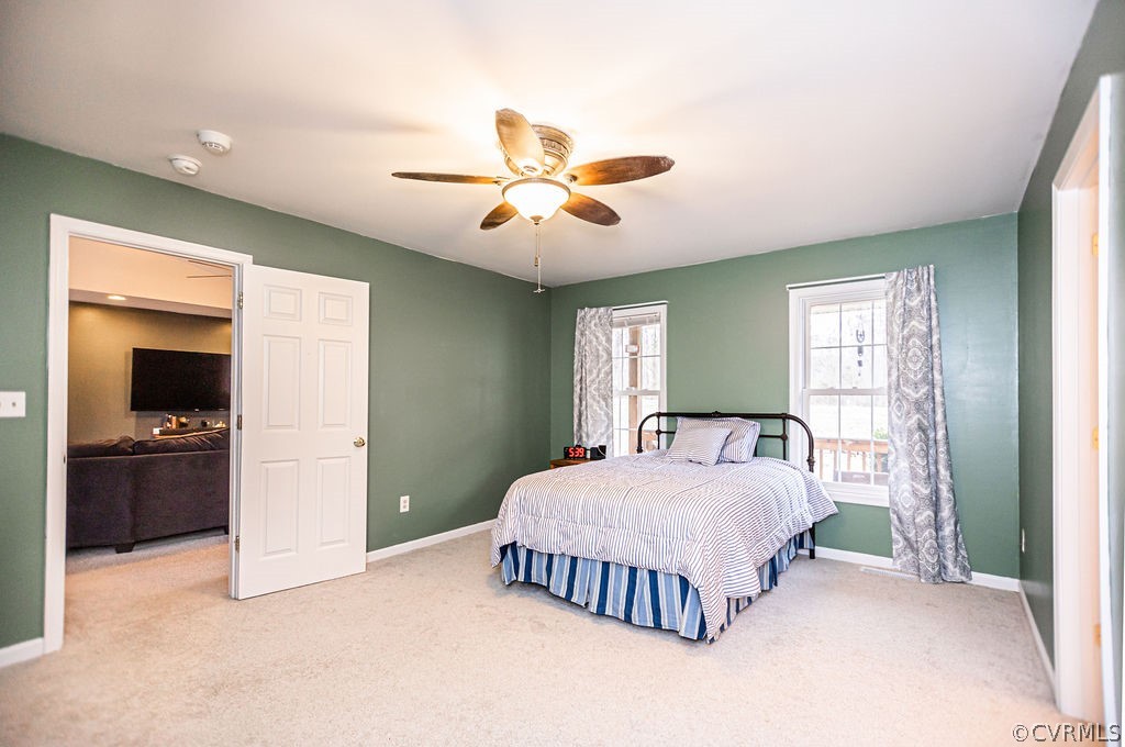 1595 Scuffletown Road Rice, VA 23966 - Photo 34 of 49 a bedroom with a bed and a chandelier