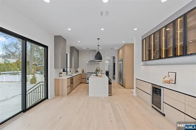 a bathroom with a sink shower and a mirror