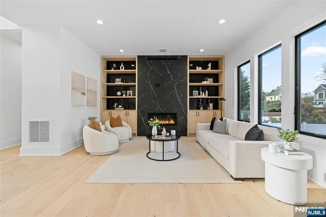 a spacious bedroom with a bed and a painting on the wall