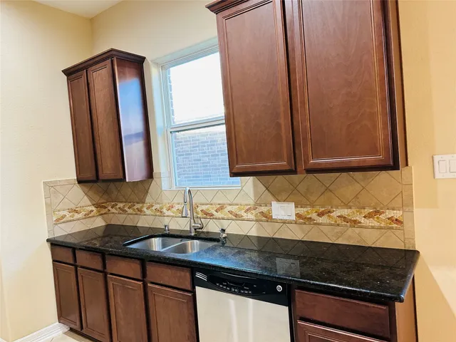 a sink sitting next to a bathroom sink