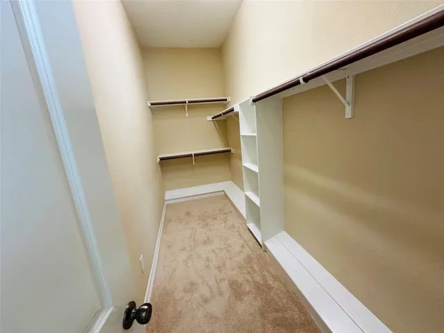 a bathroom with a granite countertop shower and a sink