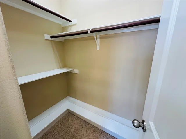 a bathroom with a bathtub sink and mirror