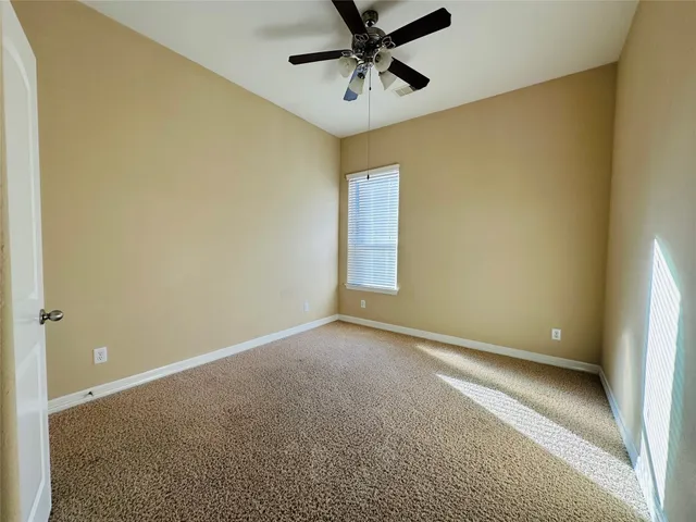 a bathroom with a double vanity sink and mirror
