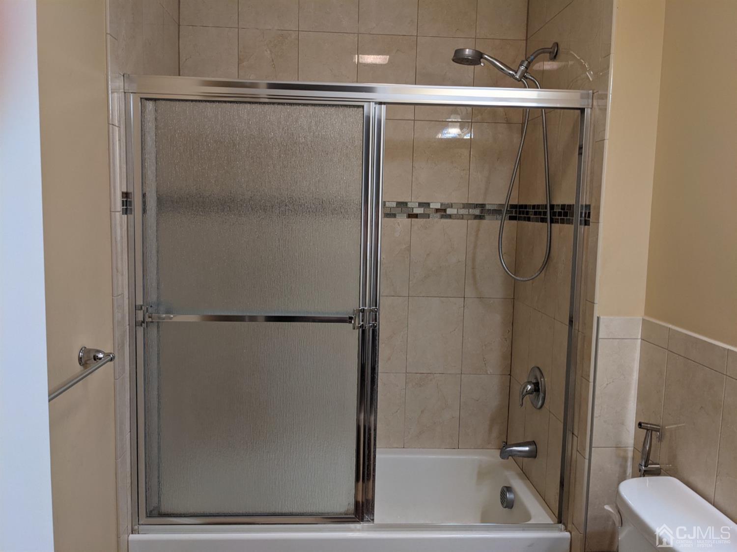32 Cinder Road, Unit 23 Edison, NJ 08820 - Photo 4 of 6 a bathroom with a shower