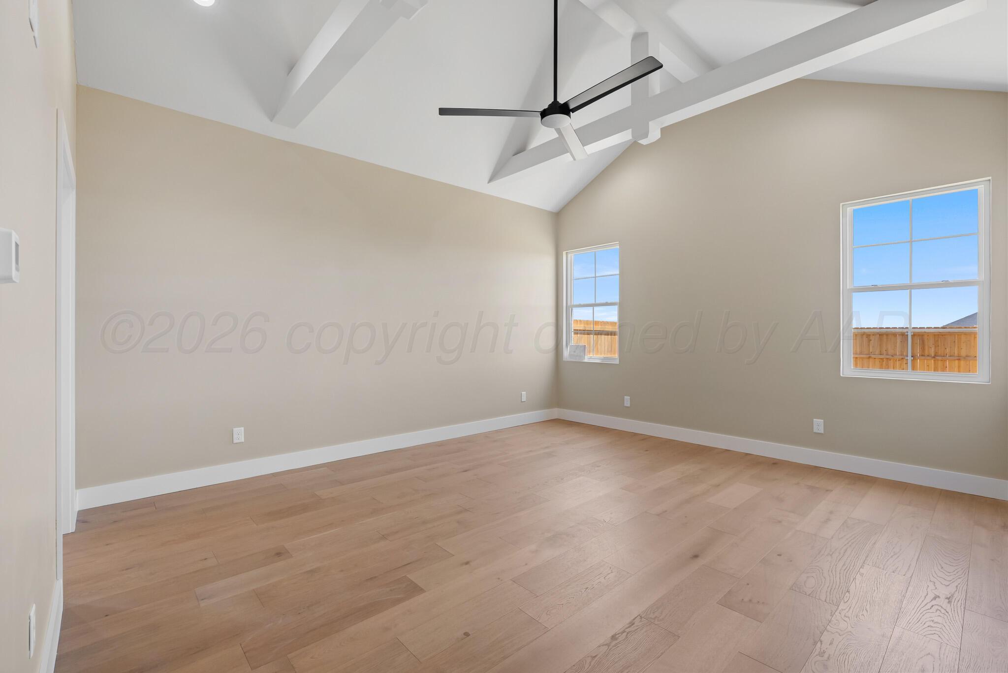 4201 Juniper Springs Road Amarillo, TX 79119 - Photo 14 of 27 an empty room with windows and fan