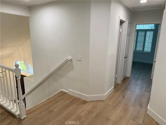 a view of an entryway with wooden floor