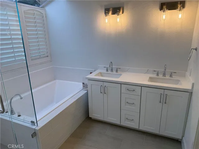 a bathroom with a bathtub and a shower