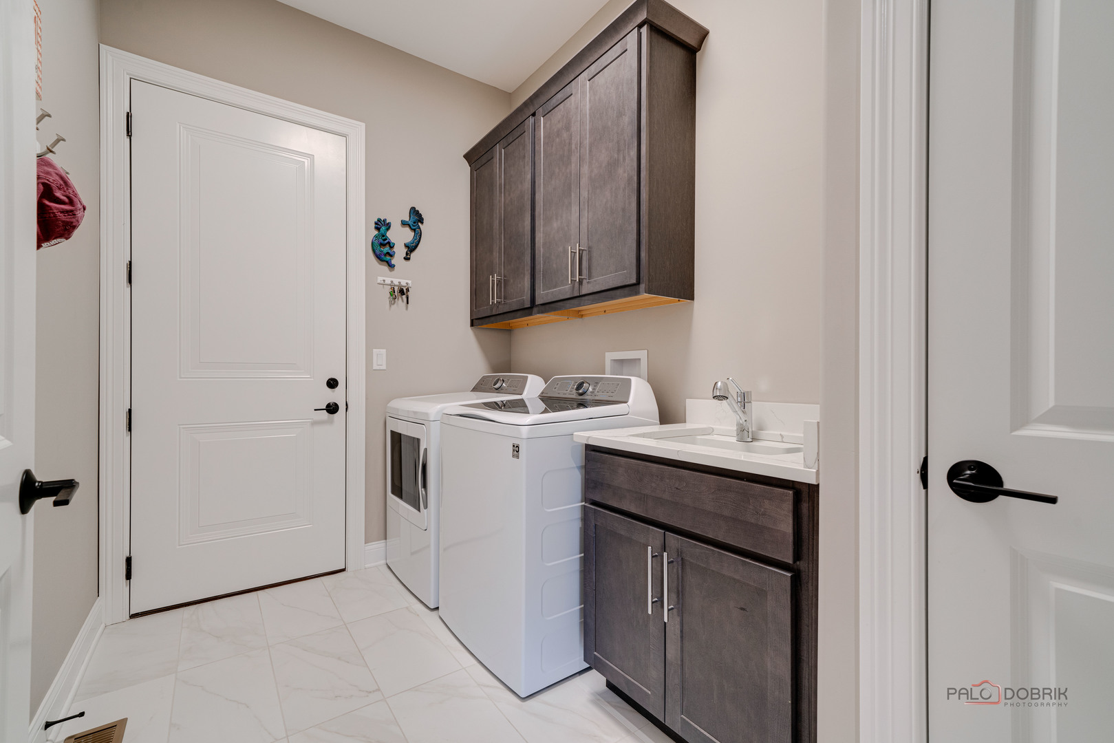 3300 Cornflower Way Spring Grove, IL 60081 - Photo 14 of 34 a utility room with cabinets washer and dryer