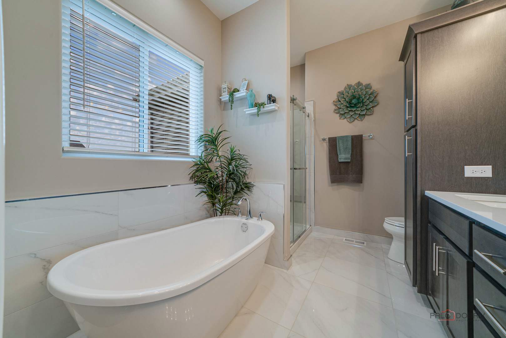3300 Cornflower Way Spring Grove, IL 60081 - Photo 16 of 34 a white bath tub sitting in a bathroom next to a toilet