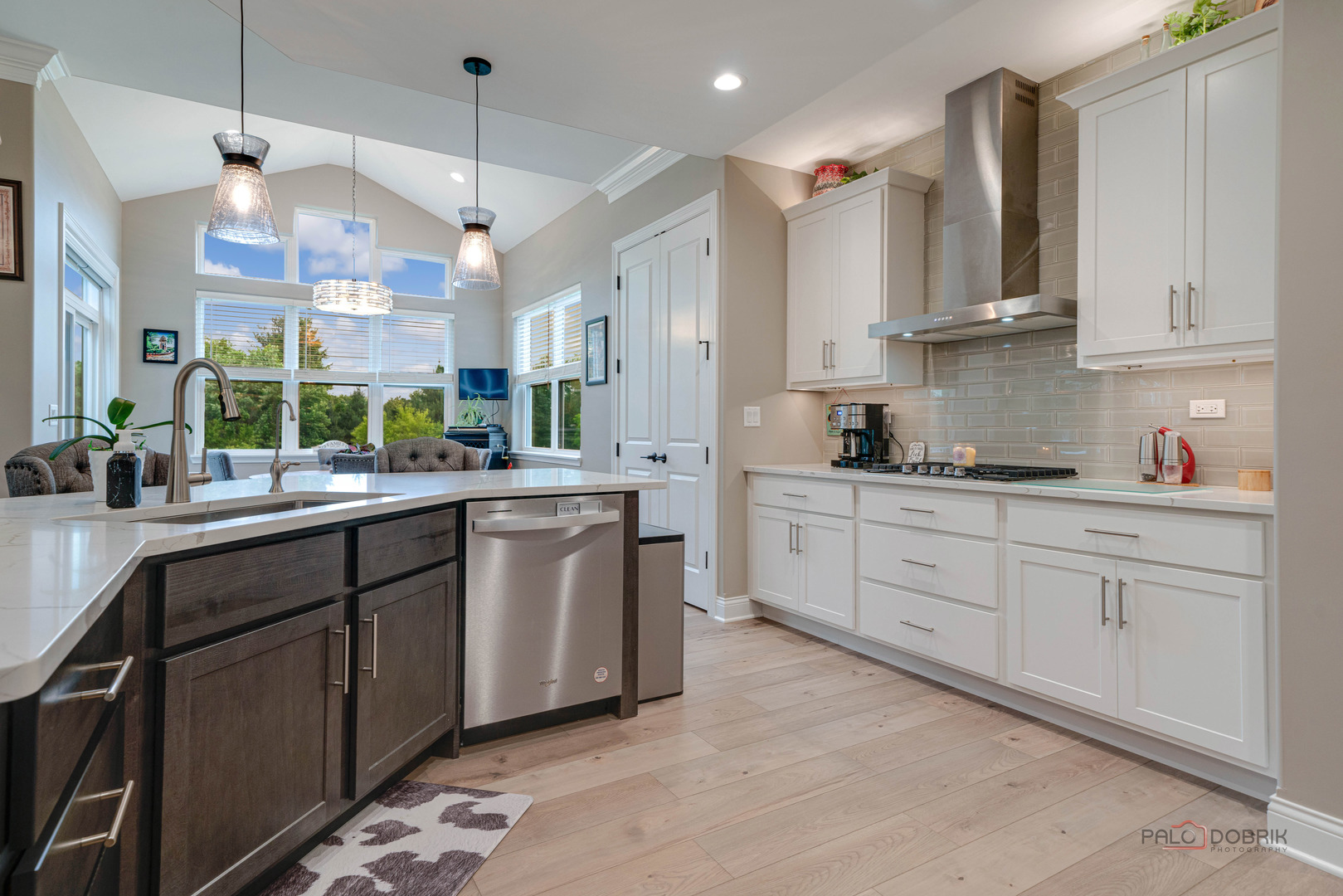 3300 Cornflower Way Spring Grove, IL 60081 - Photo 9 of 34 a kitchen with stainless steel appliances kitchen island granite countertop a sink and cabinets