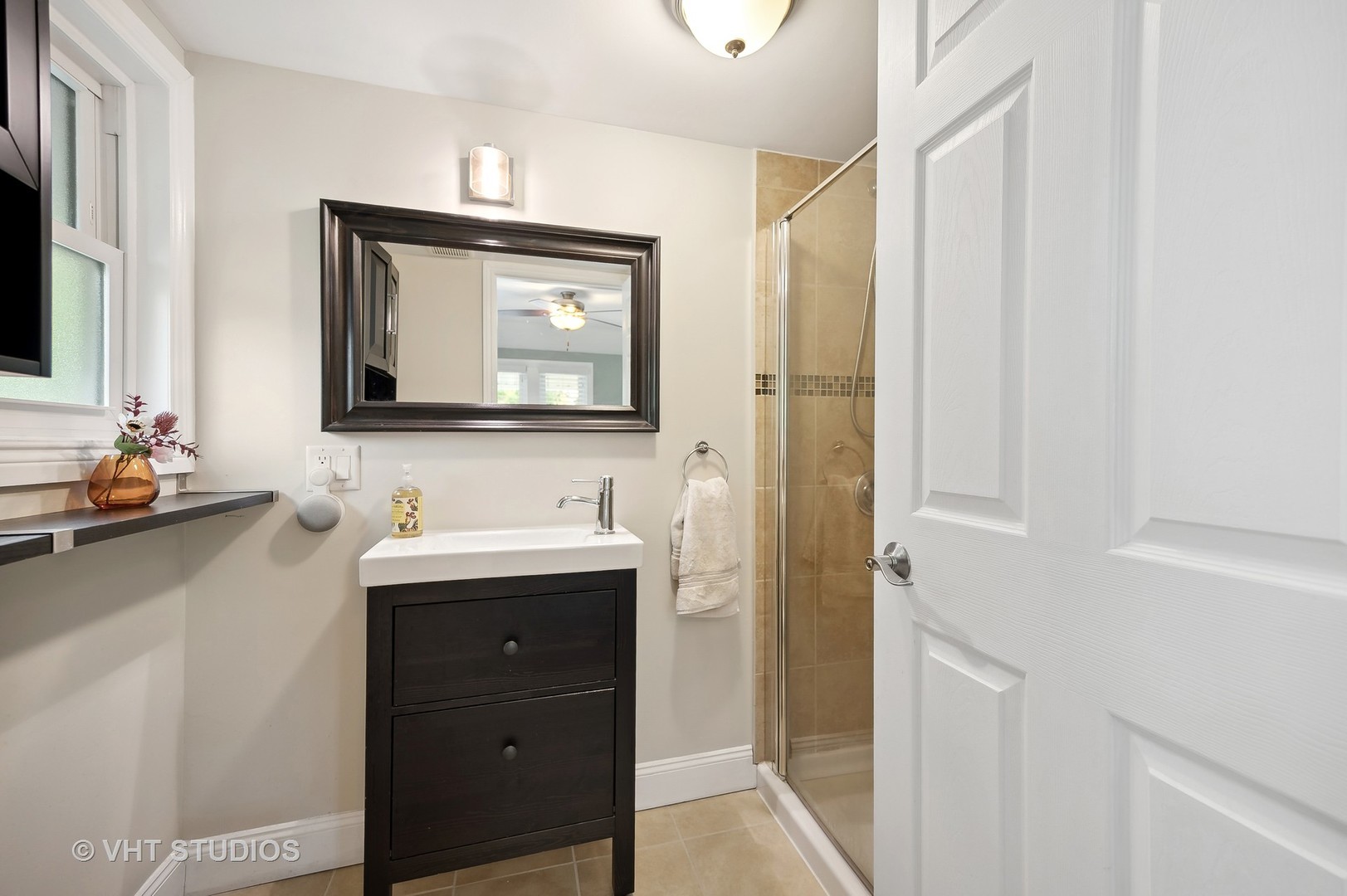 972 Tower Road Winnetka, IL 60093 - Photo 13 of 26 a bathroom with a sink and a mirror