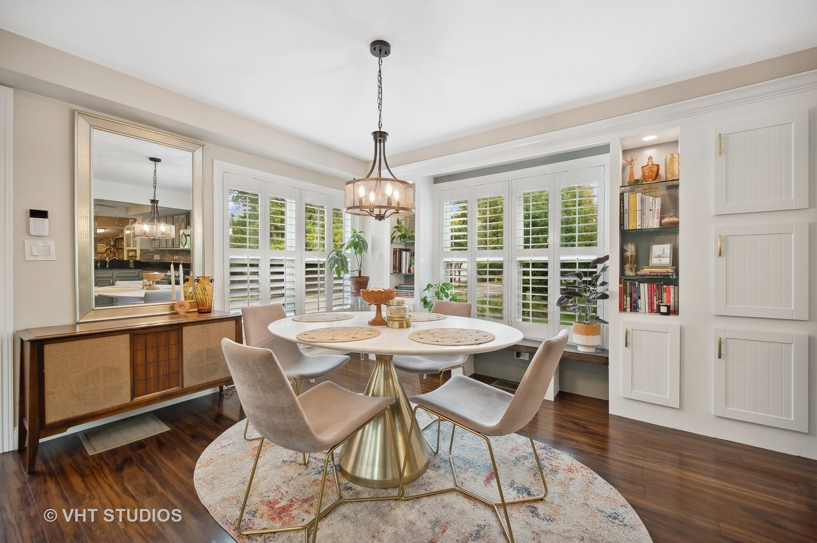 972 Tower Road Winnetka, IL 60093 - Photo 6 of 26 a view of a dining room with furniture large windows and wooden floor