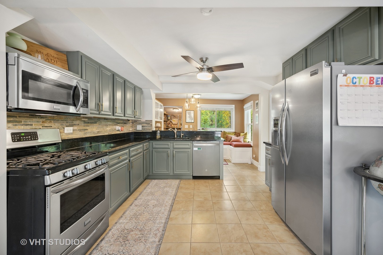 972 Tower Road Winnetka, IL 60093 - Photo 7 of 26 a kitchen with stainless steel appliances granite countertop a stove a sink and a refrigerator