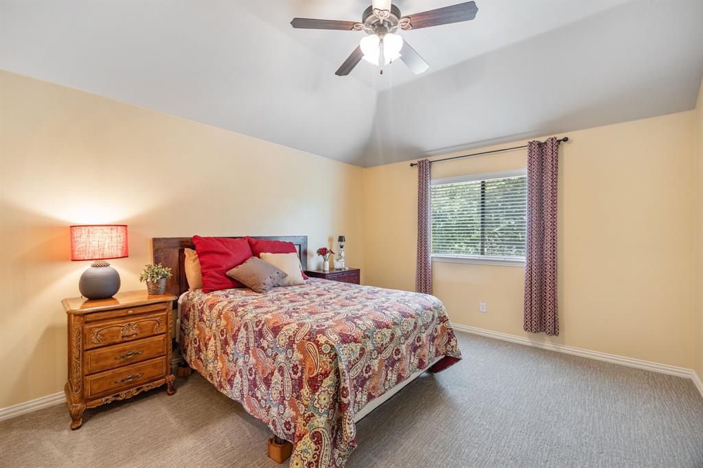 8104 Red Riv Run North Richland Hills, TX 76180 - Photo 25 of 38 a bedroom with a bed and window