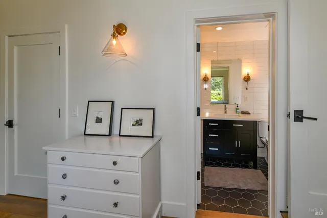 a bathroom with a shower sink and mirror