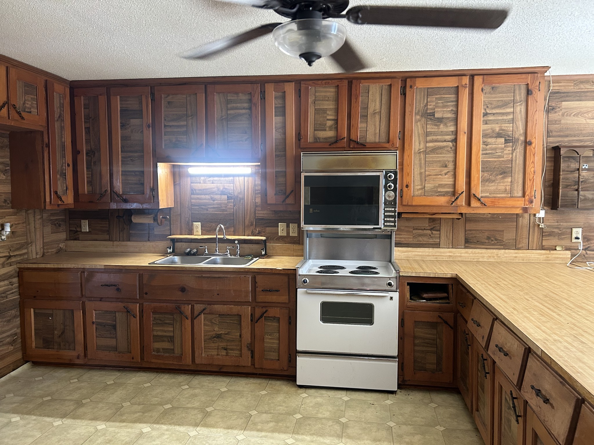 236 Beartown Road Loretto, TN 38469 - Photo 12 of 19 a kitchen with a stove sink and cabinets