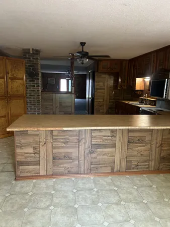 a view of room with cabinets and flat screen tv
