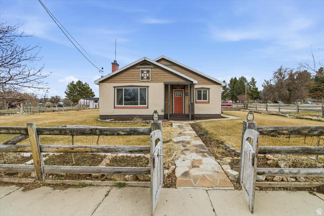 287 South 100 East Spring City, UT 84662 - Photo 2 of 44 Bungalow with a fenced front yard and a chimney
