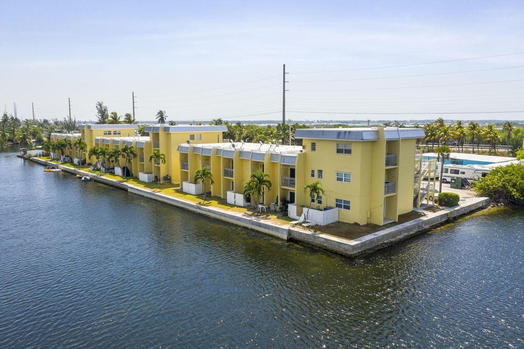 201 Coppitt Road, Unit 104B Key West, FL 33040 - Photo 12 of 13 a view of a ocean with boats and trees