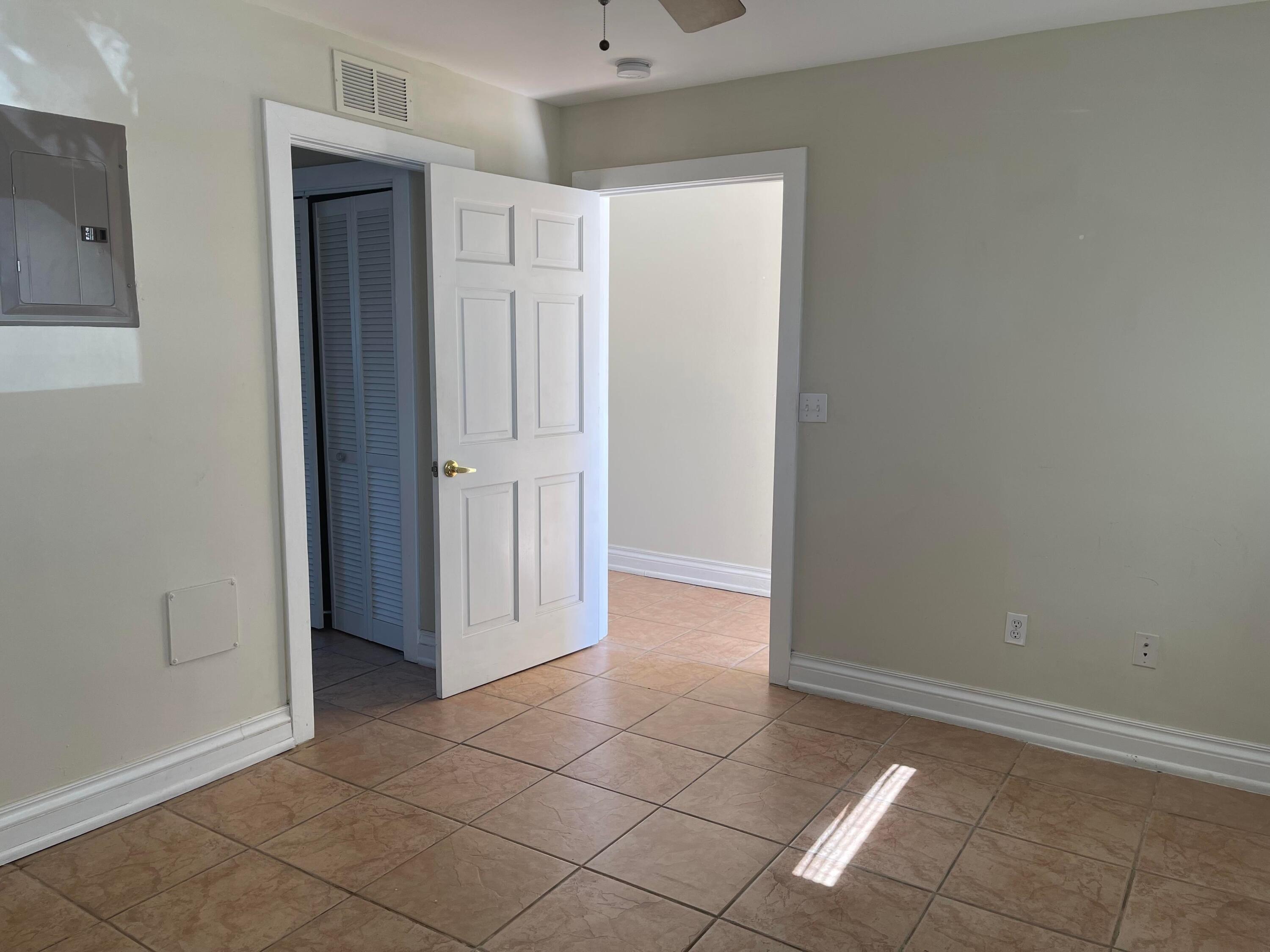 201 Coppitt Road, Unit 104B Key West, FL 33040 - Photo 7 of 13 an empty room with a door