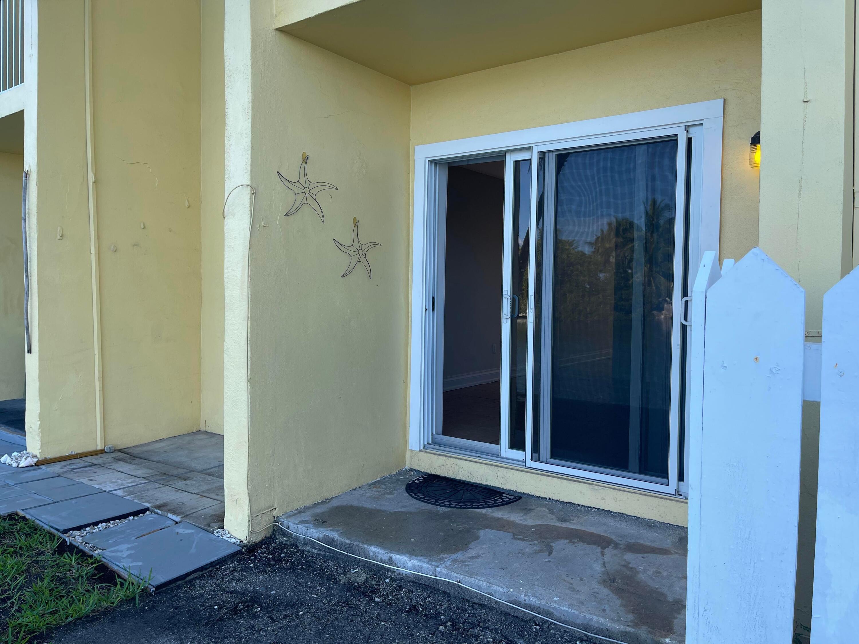 201 Coppitt Road, Unit 104B Key West, FL 33040 - Photo 9 of 13 a view of a wooden door
