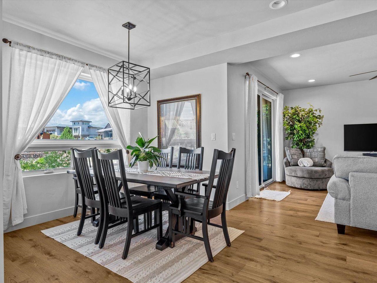 365 West Ridges Boulevard, Unit A Grand Junction, CO 81507 - Photo 11 of 42 a view of a dining room with furniture window and wooden floor