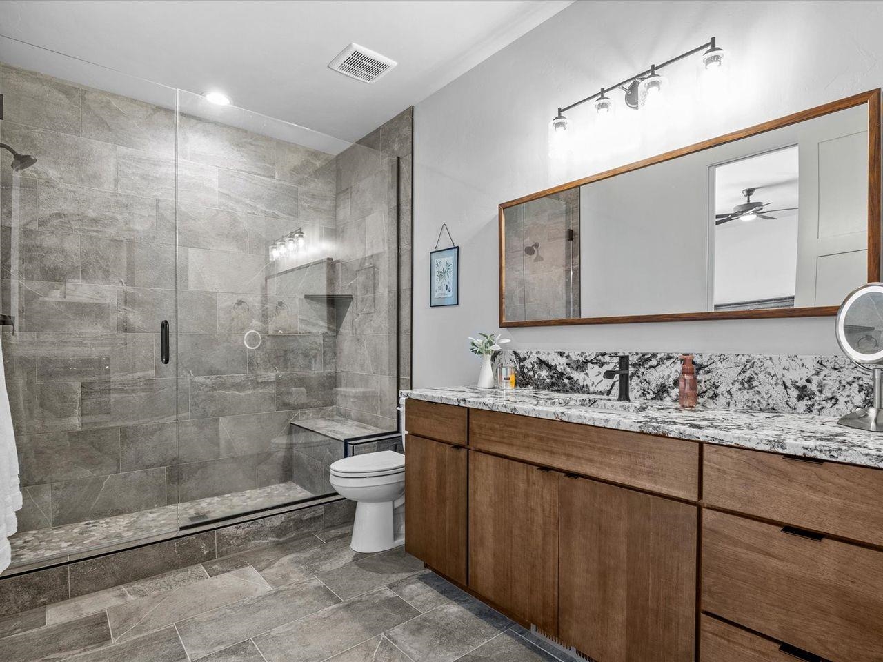 365 West Ridges Boulevard, Unit A Grand Junction, CO 81507 - Photo 17 of 42 a bathroom with a sink a toilet and shower