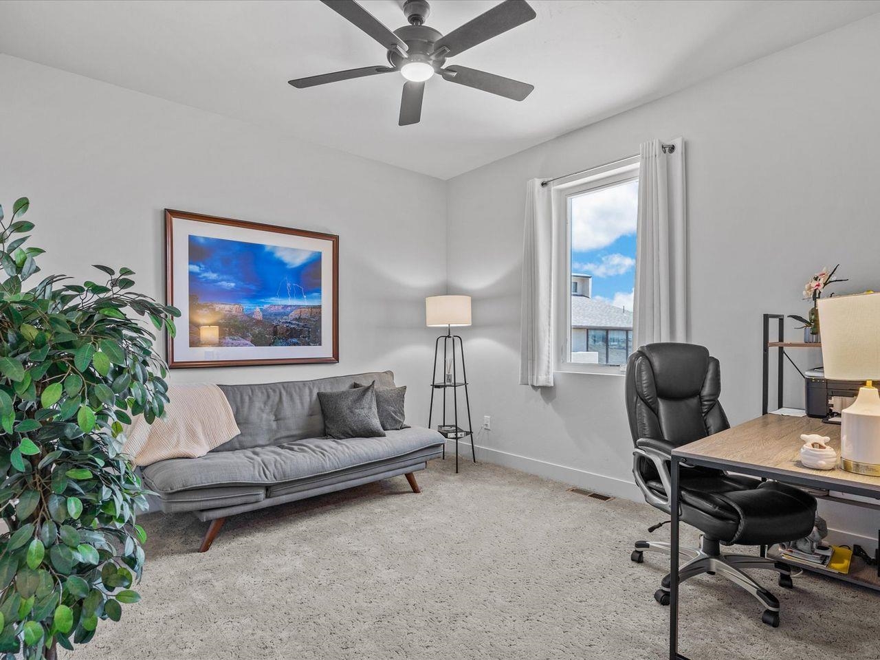 365 West Ridges Boulevard, Unit A Grand Junction, CO 81507 - Photo 20 of 42 a living room with furniture and a potted plant