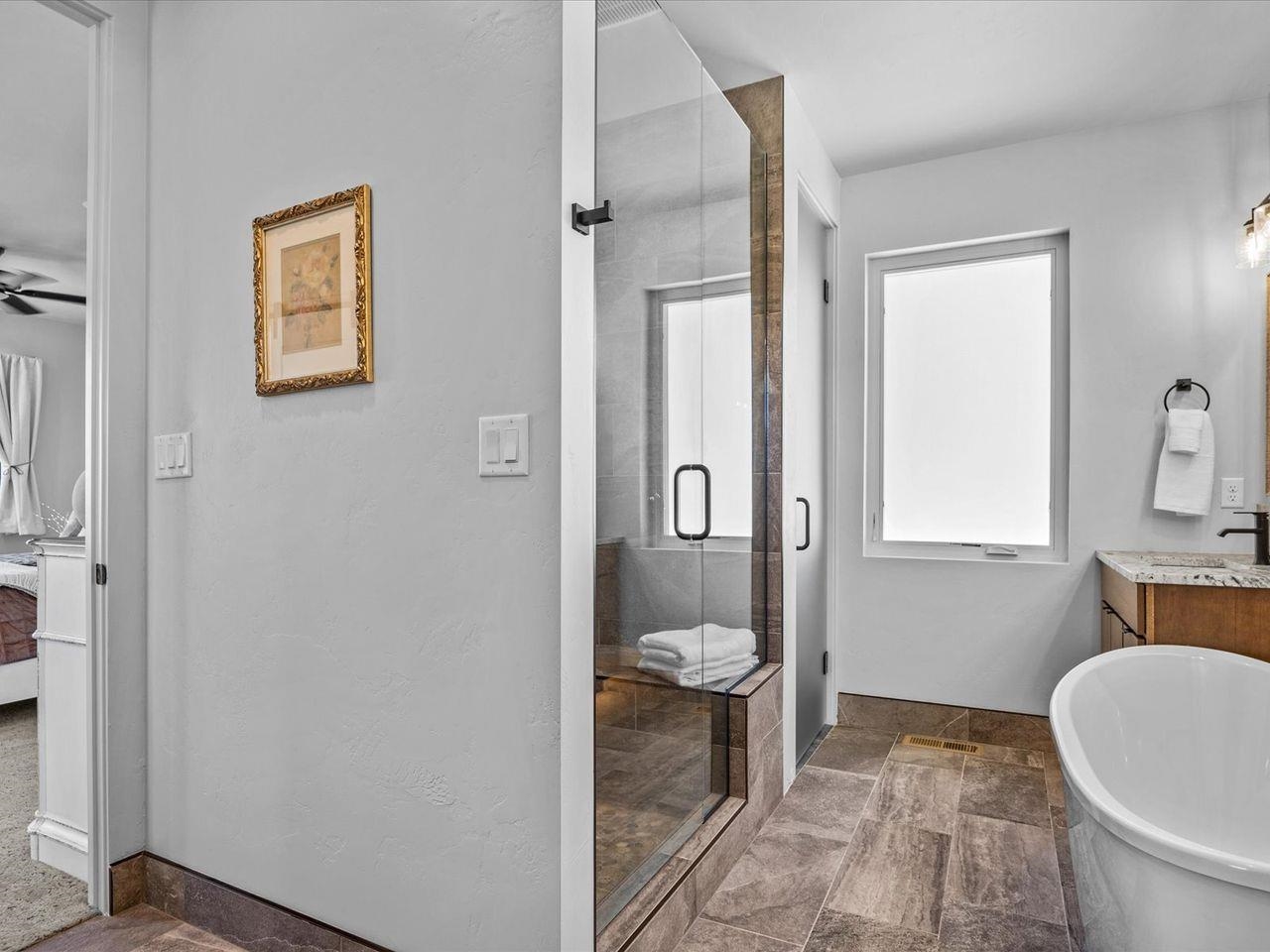 365 West Ridges Boulevard, Unit A Grand Junction, CO 81507 - Photo 30 of 42 a bathroom with a toilet a sink and a mirror
