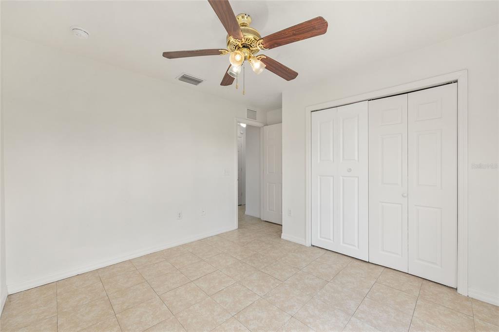 15434 Southwest 23rd Court Road Ocala, FL 34473 - Photo 31 of 41 an empty room with chandelier fan
