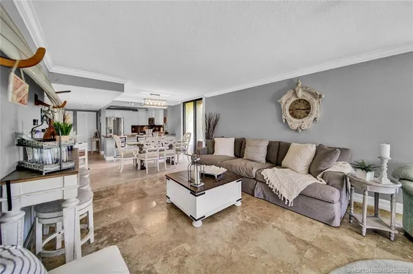 a living room with furniture and a rug