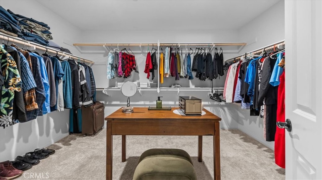 35580 Roxy Road Beaumont, CA 92223 - Photo 18 of 39 a view of walk in closet with clothes shoes and a closet