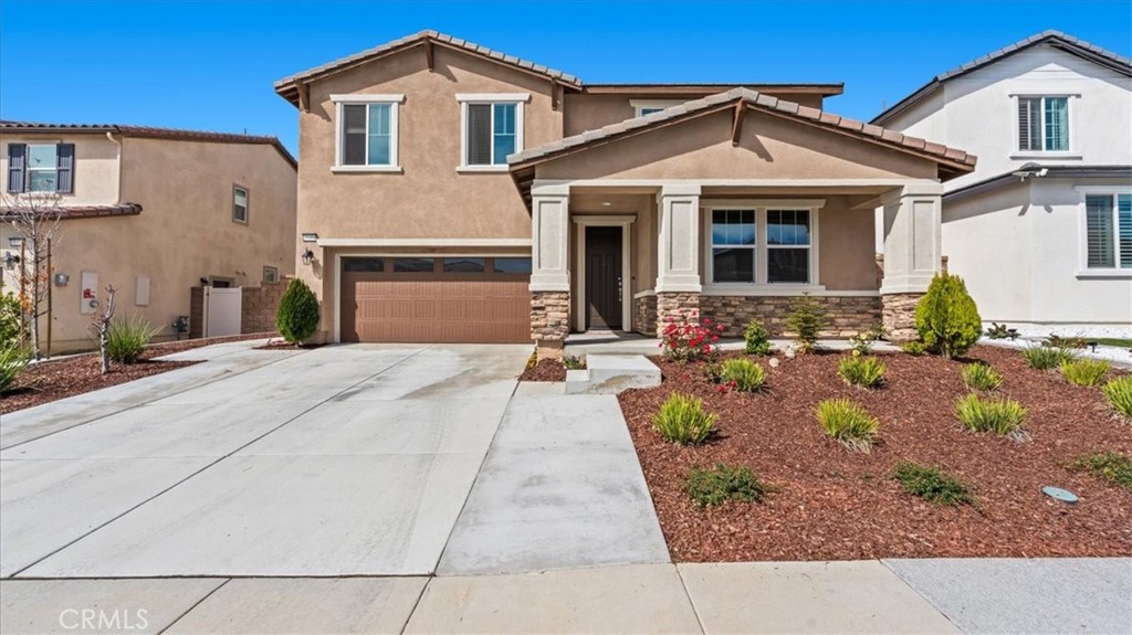 35580 Roxy Road Beaumont, CA 92223 - Photo 2 of 39 a front view of a house with garden