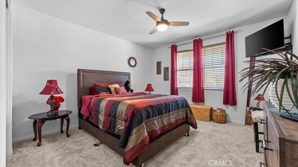 35580 Roxy Road Beaumont, CA 92223 - Photo 22 of 39 a bed room with a bed and a tv