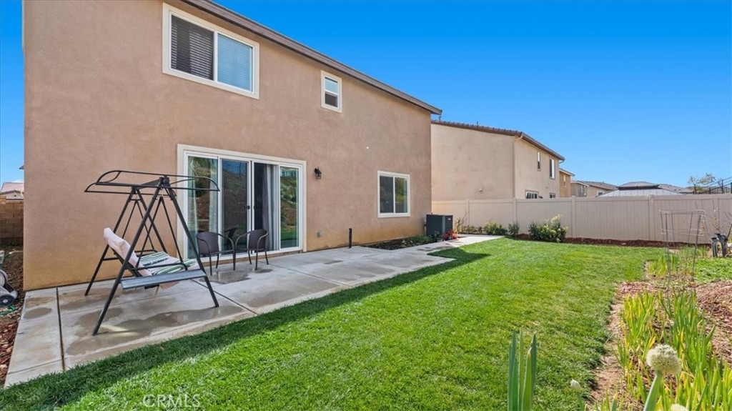 35580 Roxy Road Beaumont, CA 92223 - Photo 28 of 39 a view of a house with backyard and a tree