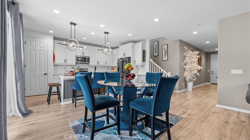 35580 Roxy Road Beaumont, CA 92223 - Photo 7 of 39 a dining room with furniture and wooden floor