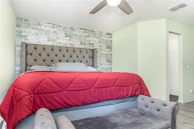 a bedroom with a bed and a couch