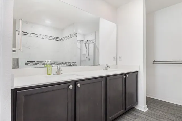 a bathroom with a sink and a mirror