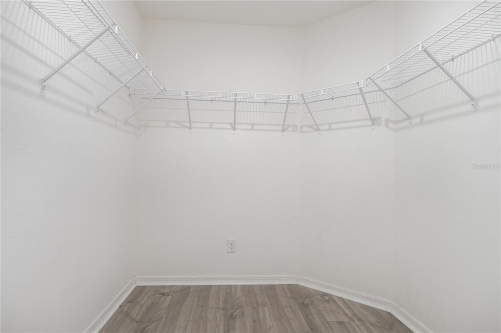 1760 Canaan Loop Dundee, FL 33838 - Photo 19 of 25 a view of a room with racks on the wall