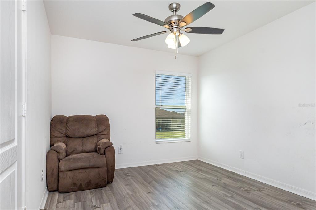 1760 Canaan Loop Dundee, FL 33838 - Photo 22 of 25 an empty room with furniture and a window