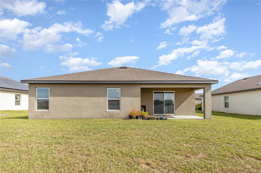 1760 Canaan Loop Dundee, FL 33838 - Photo 25 of 25 a front view of house with yard