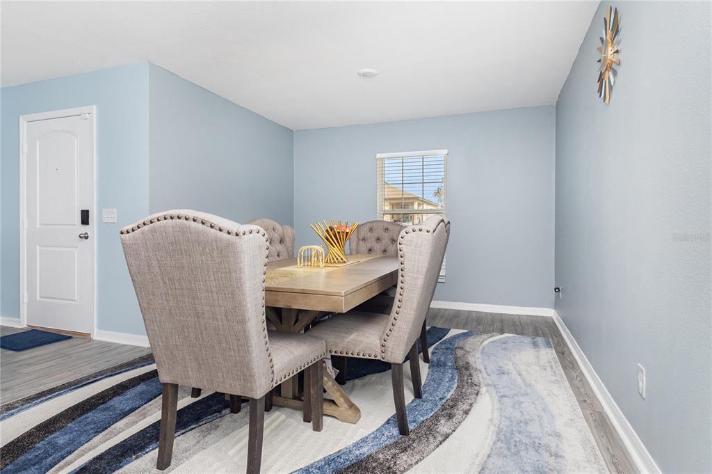 1760 Canaan Loop Dundee, FL 33838 - Photo 6 of 25 a workspace with furniture and wooden floor