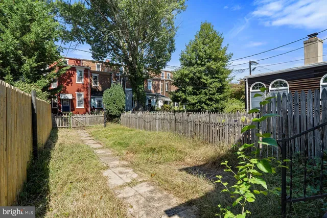 a view of swimming pool with a yard
