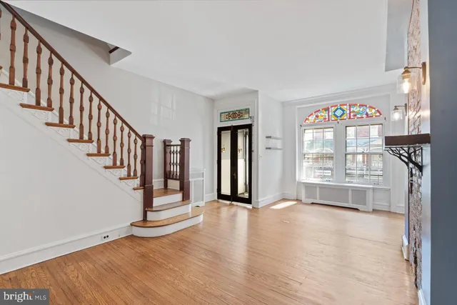 a view of an entryway with wooden floor