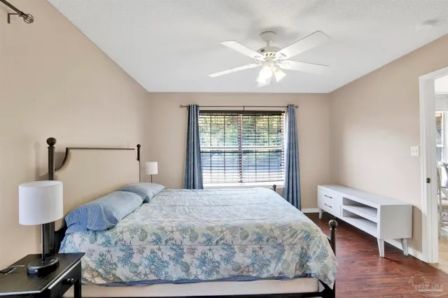 a bedroom with a large bed and a window