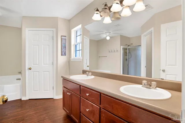 a bathroom with a double vanity sink and a mirror