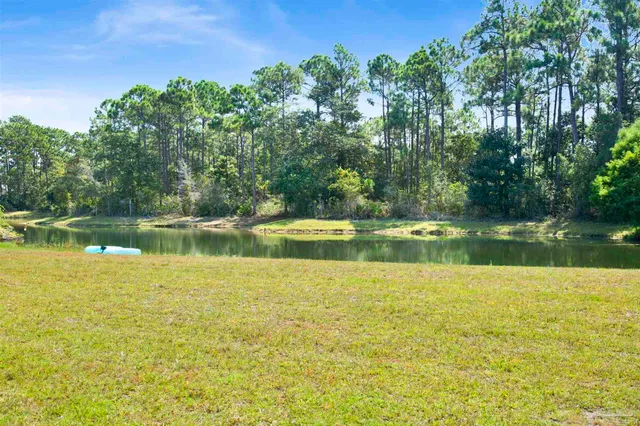 a view of a lake with a big yard