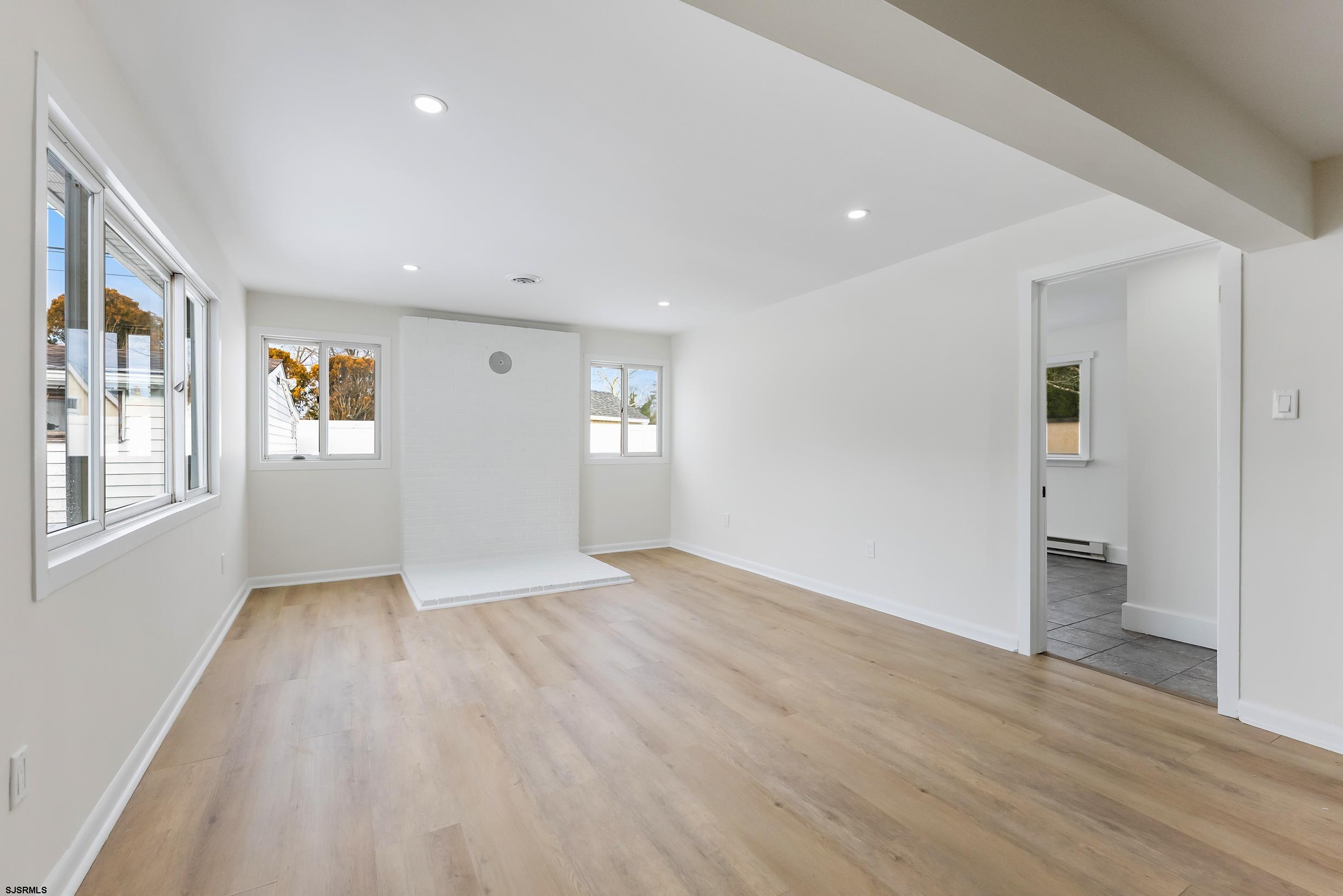 1805 Zion Road Northfield, NJ 08225 - Photo 14 of 25 wooden floor in an empty room with a window