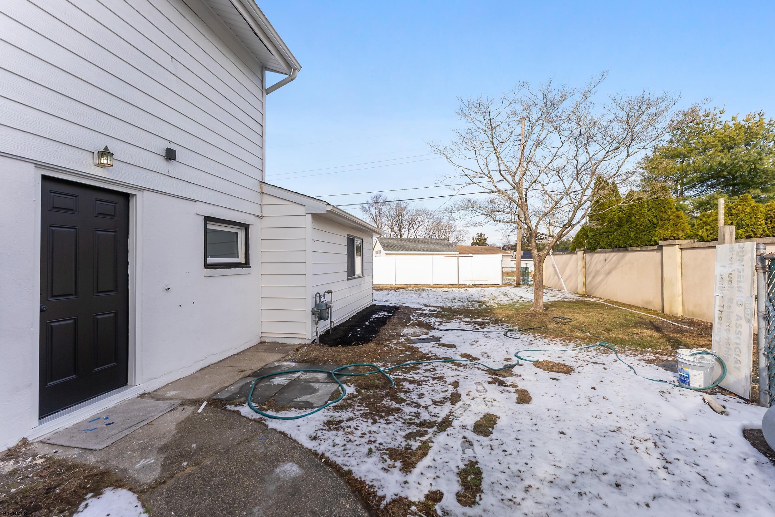1805 Zion Road Northfield, NJ 08225 - Photo 22 of 25 a backyard of a house with a large tree