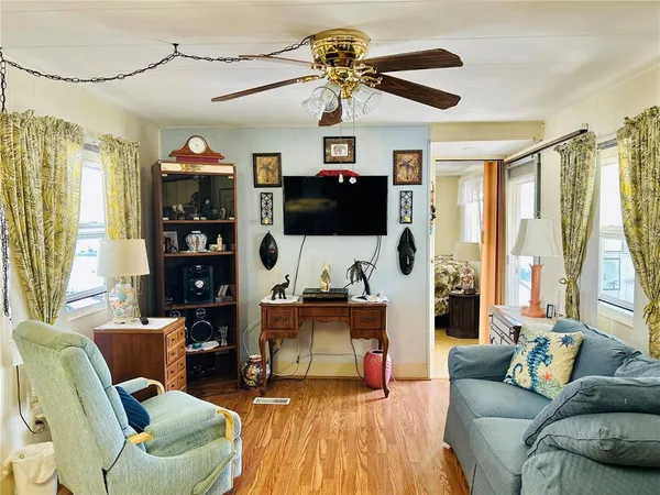 a view of a dining room with furniture and wooden floor